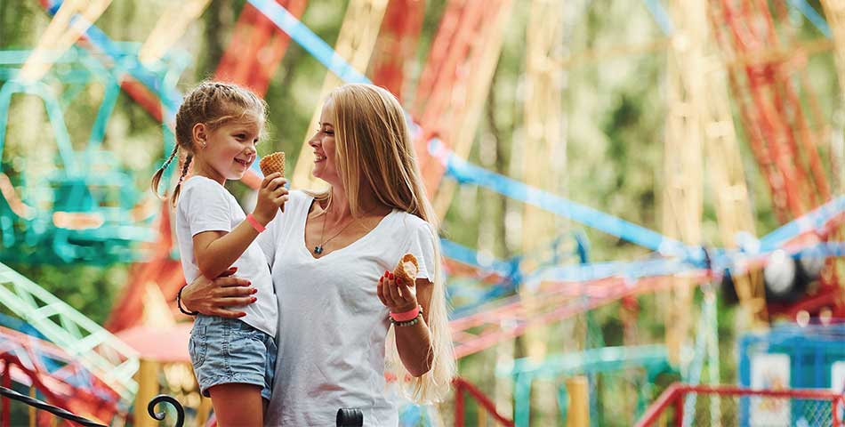 Mother and daughter wearing tyvek paper identification wristbands for admission and ride access at amusement park in Canada