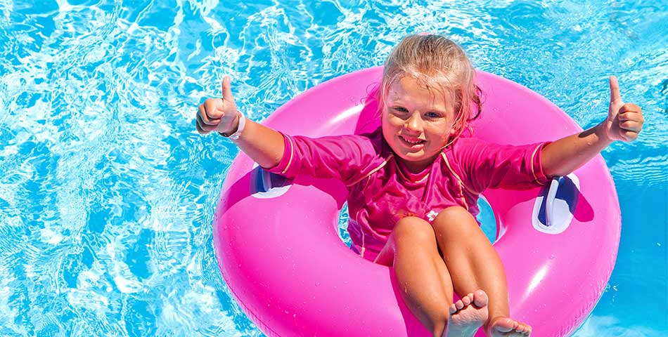 Young child wearing waterproof plastic snap wristband at Canadian waterpark