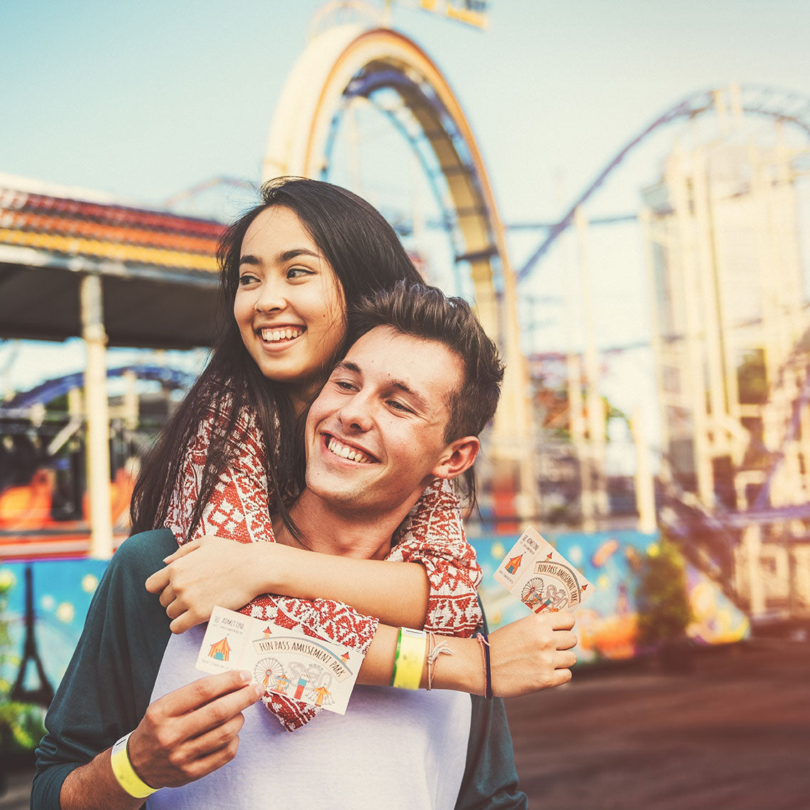 Guests at amusement park wearing bright yellow paper tyvek id wristbands