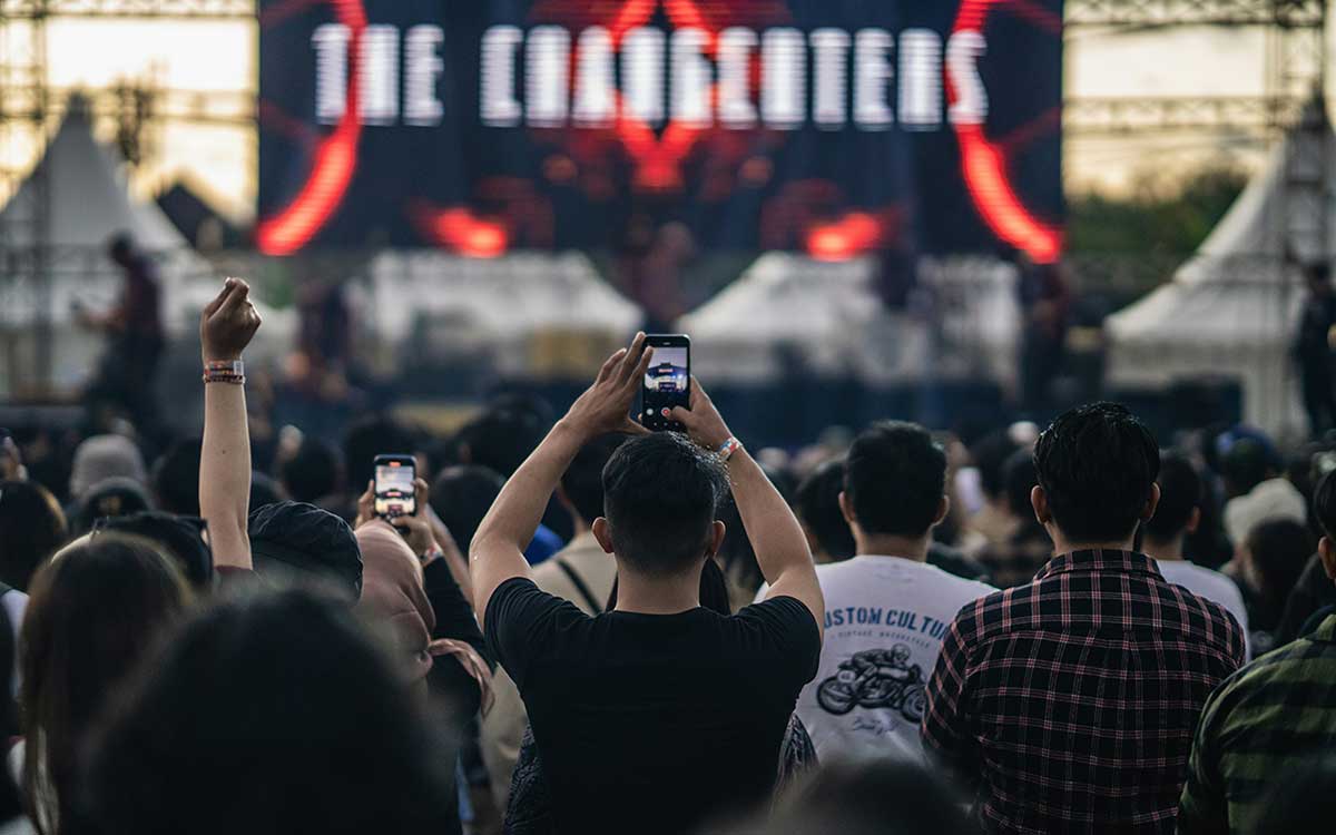 Crowd at music concert in Canada wearing full color custom printed tyvek paper event wristbands with QR codes